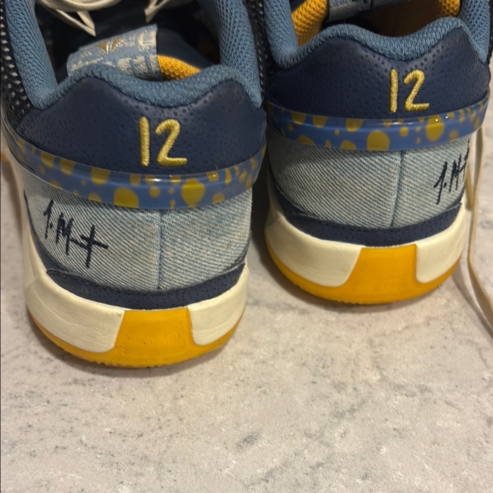 Nike Blue and Yellow Athletic Shoes with Modern Design